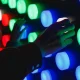 hand touching colored lights at interactive corporate events
