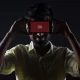 a man holding cell phone over his face showing streaming platforms