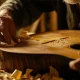 handmade craftsmanship man making guitar